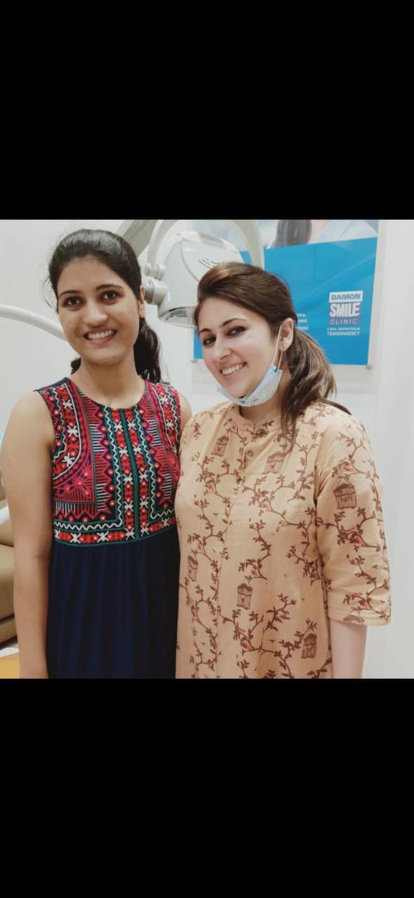 Happy adult patient smiling after braces removal at White Dental Healthcare, Indirapuram